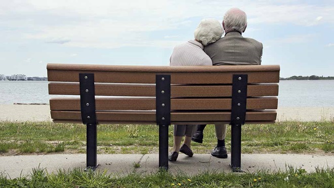 elderly couple of park bench